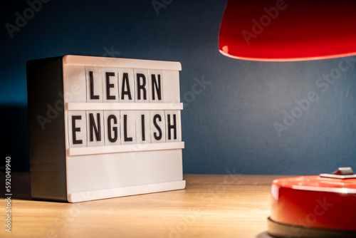 Learning English concept. Learn English message on white letter board. Language learning concept background.