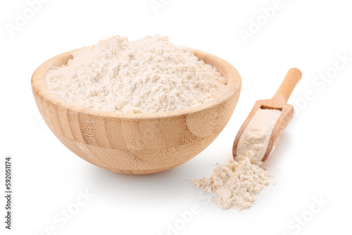 Wooden bowl and scoop with wheat flour isolated on white background