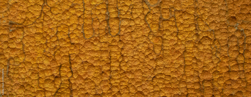 golden etched metal pitting background, close-up golden etched metal pitting background, close-up