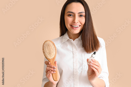 Woman with serum for hair l...