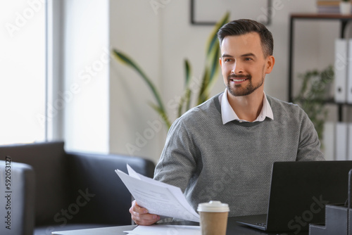 Handsome businessman workin...
