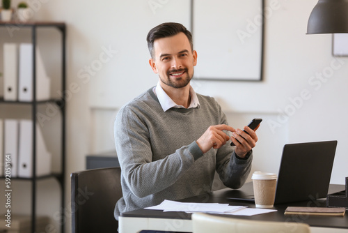 Handsome businessman workin...