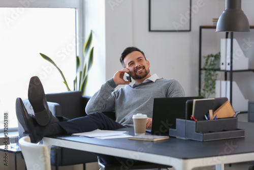 Handsome businessman talkin...