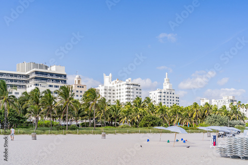Miami Beach, USA - December 4, 2022. View of the sand of Miami Beach and the art deco buildings behind