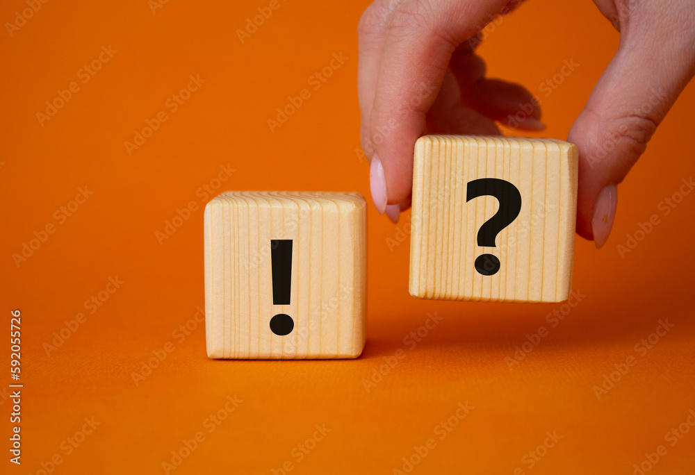 Question mark and exclamation mark symbol. Businessman hand is making a ...