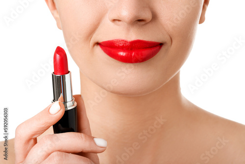 Woman with red lipstick on white background, closeup © Pixel-Shot