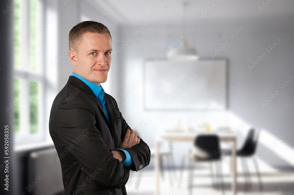 Portrait of smiling businessman in corporate office