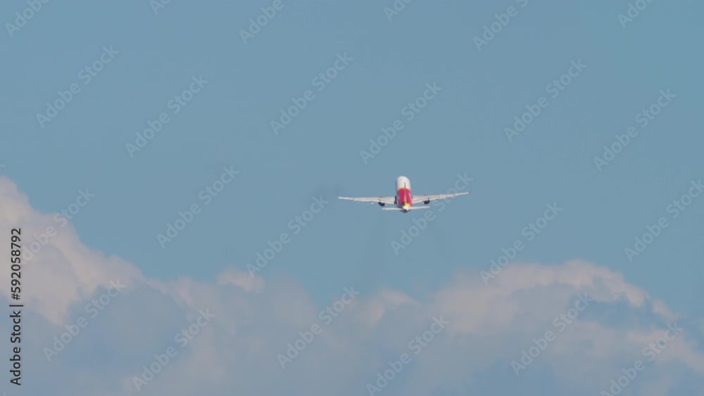 Unrecognizable plane takeoff, climb. Long shot rear view of a passenger plane flying away. Airliner in blue cloudy sky. Tourism and travel concept Unrecognizable plane takeoff, climb. Long shot rear view of a passenger plane flying away. Airliner in blue cloudy sky. Tourism and travel concept