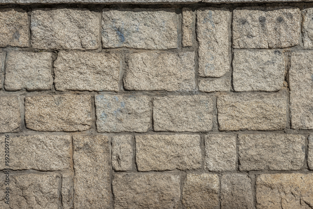 A wall of granite blocks with cement. vector background stone texture background A wall of granite blocks with cement. vector background stone texture background