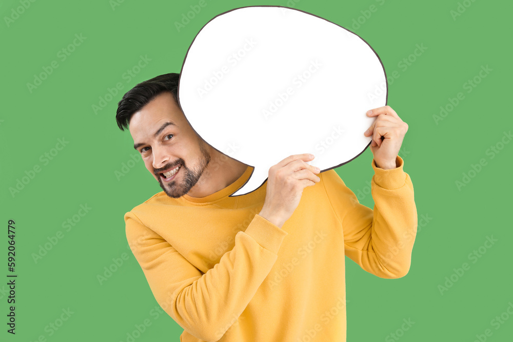 Handsome man with blank speech bubble on green background Handsome man with blank speech bubble on green background