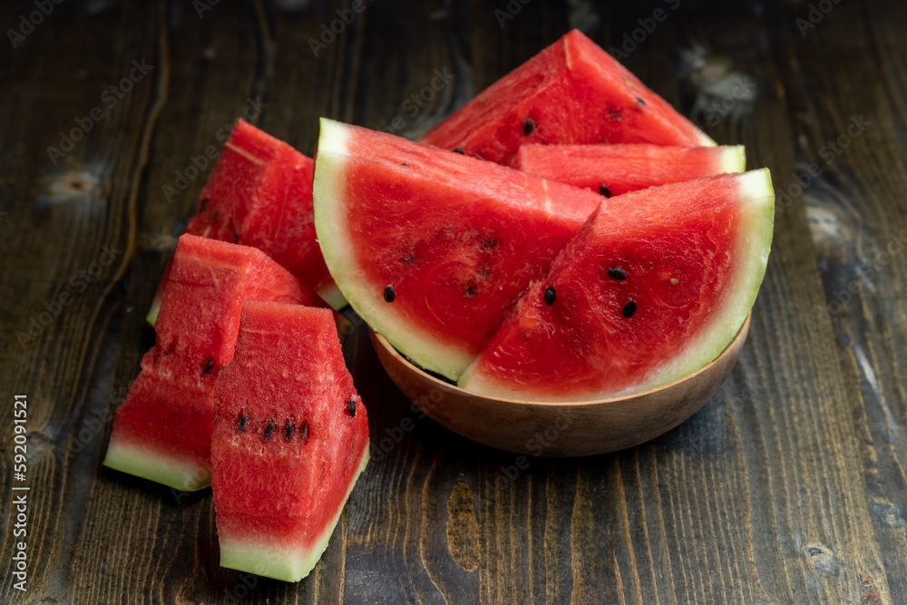 Sliced red and ripe watermelon on the table Sliced red and ripe watermelon on the table