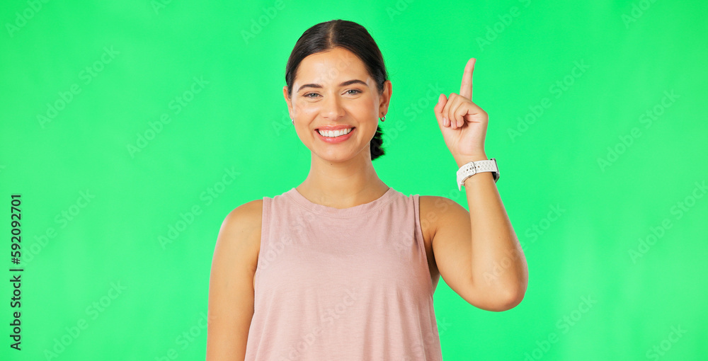 Woman face, pointing up and green screen with happiness and smile showing mockup for advertisement. Portrait, isolated and studio background with a happy young female point to show promotion deal Woman face, pointing up and green screen with happiness and smile showing mockup for advertisement. Portrait, isolated and studio background with a happy young female point to show promotion deal