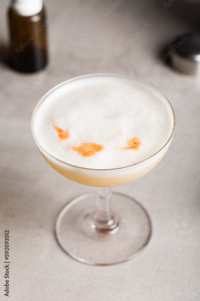 Whiskey Sour cocktail booze bourbon whiskey, lemon juice, simple syrup, egg white and aromatic bitters