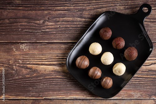 Delicious chocolate truffles on the table.