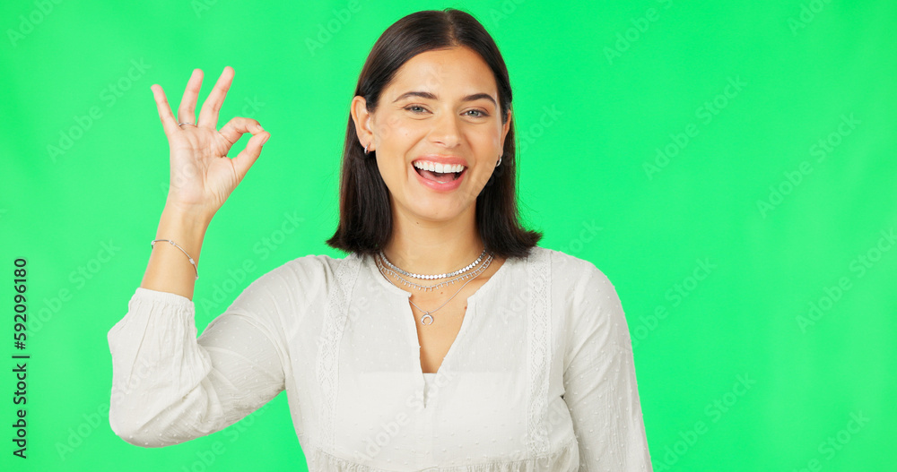 Ok hands, face and happy woman on green screen, background and studio in agreement of support. Portrait of female model, smile and okay for success, yes and winner of perfect emoji, thank you or hope Ok hands, face and happy woman on green screen, background and studio in agreement of support. Portrait of female model, smile and okay for success, yes and winner of perfect emoji, thank you or hope