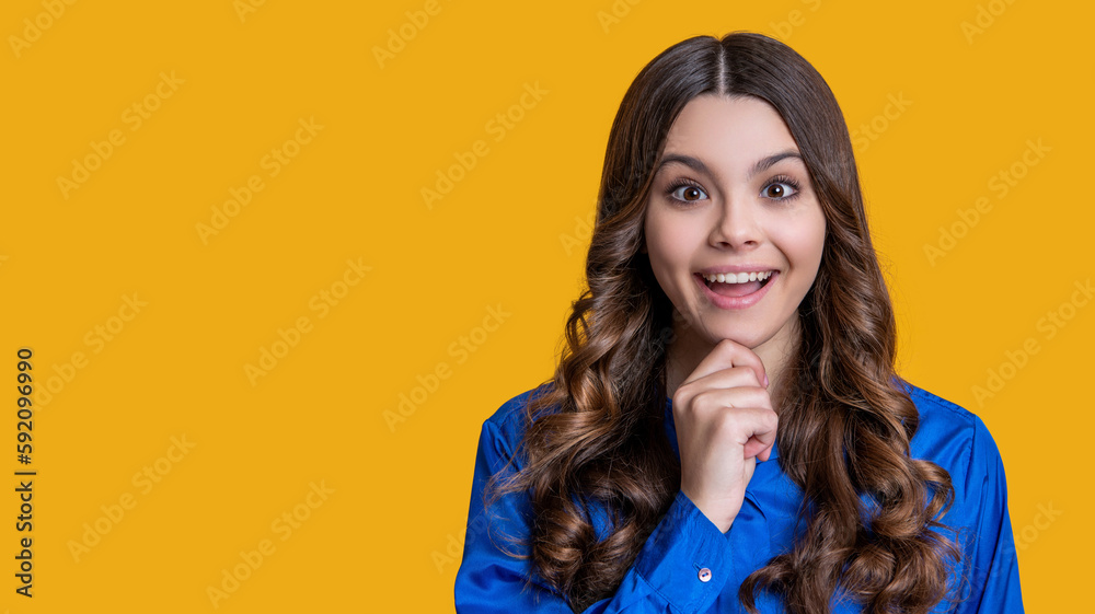 curly teen girl isolated on yellow, copy space. curly teen girl in studio. curly teen girl