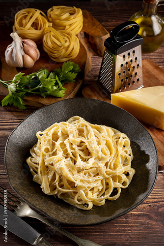 Delicious fettuccine pasta with white cheese sauce. Fettuccine pasta with Alfredo sauce. photo