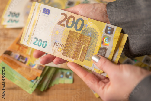  Recalculation of money.200 euro banknotes. Counting euro banknotes.Hands recalculate banknotes.Expenses and incomes in European countries. money in a hand close -up.