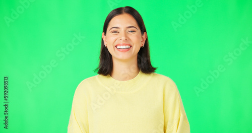 Happy, laughing and the face of a woman on a green screen isolated on a studio background. Smile, beautiful and portrait of a girl with confidence, happiness and positivity on a mockup backdrop © Nina L/peopleimages.com