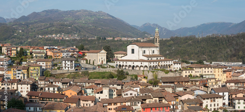 Overview of the town of Vertova (Province of Bergamo, Lombardy, Italy) with the parish church of Santa Maria Assunta rebuilt in the 18th century to a design by Giovanni Battista Quadri. April 2023.