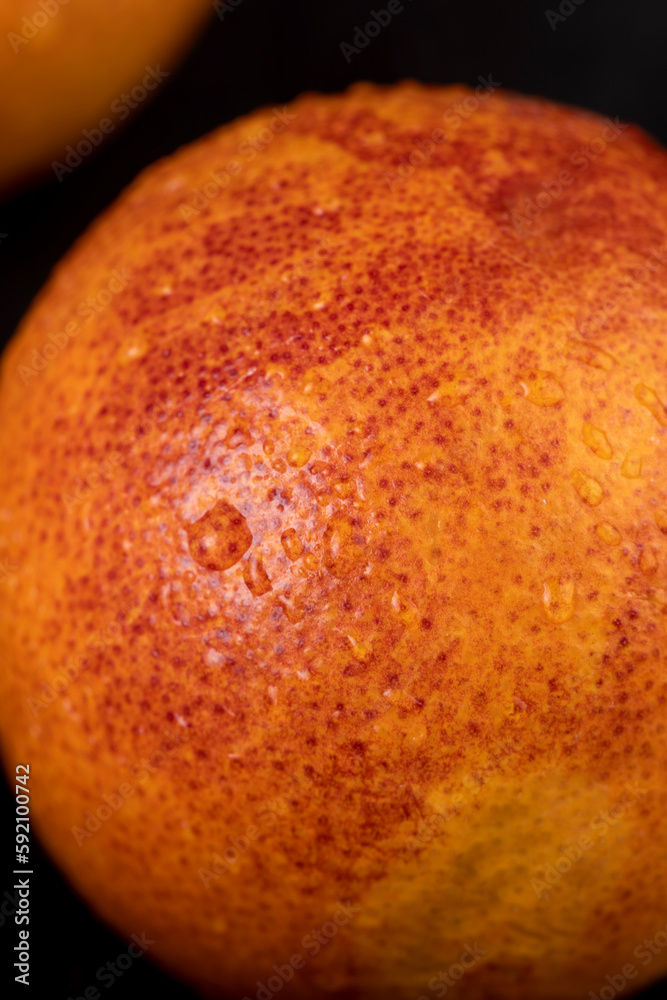 yellow-red orange peel covered with water drops yellow-red orange peel covered with water drops