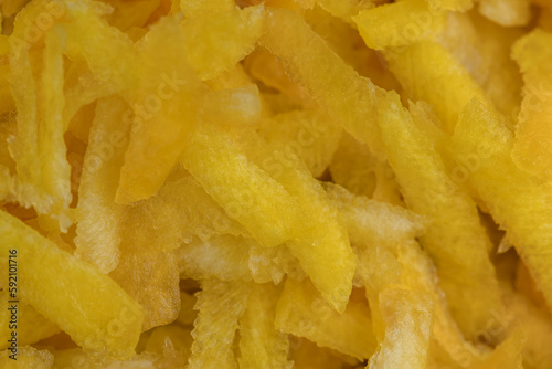 Finely grated yellow carrots in the kitchen