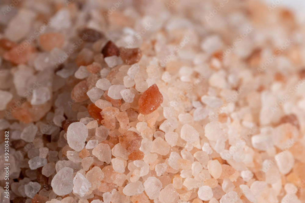 A large number of pink salt crystals of different sizes A large number of pink salt crystals of different sizes