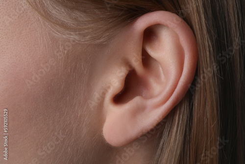 Closeup view of woman, focus on ear photo
