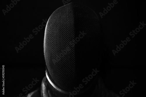 Fencing sabre mask in black and white photo