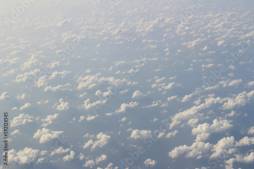 Shot taken from a plane, flying above the clouds