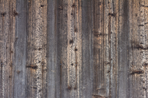 Old wooden background darkened by time.