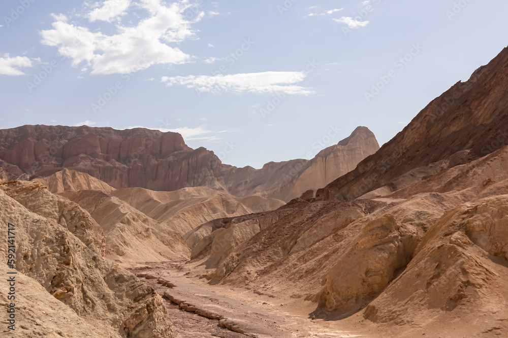 Golden Canyon trailhead with scenic view of colorful geology of multi hued Amargosa Chaos rock formations, Death Valley National Park, Furnace Creek, California, USA. Barren Artist Palette landscape