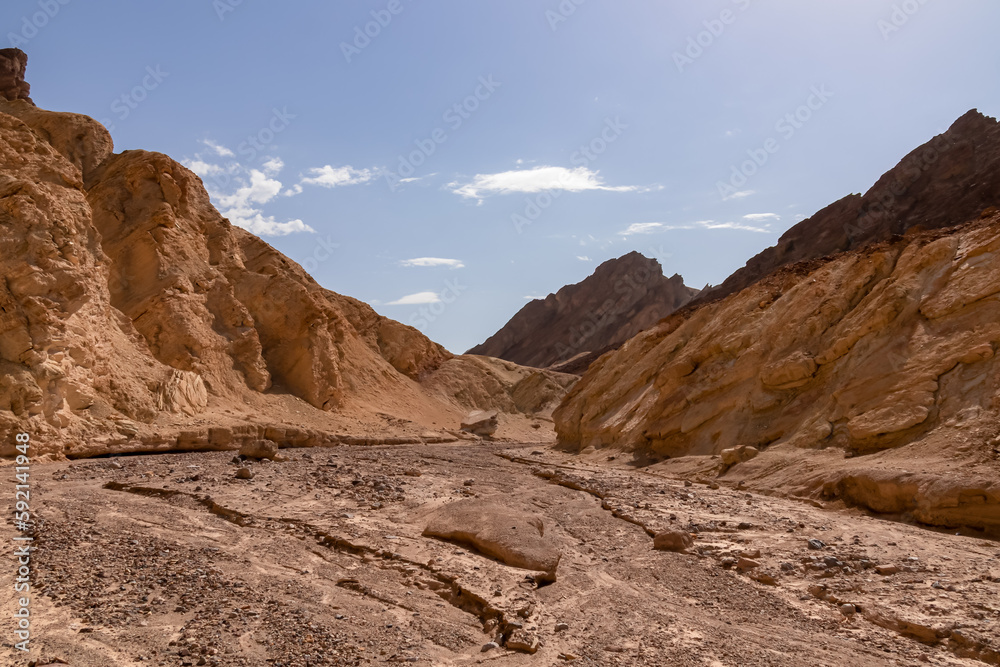 Golden Canyon trailhead with scenic view of colorful geology of multi hued Amargosa Chaos rock formations, Death Valley National Park, Furnace Creek, California, USA. Barren Artist Palette landscape