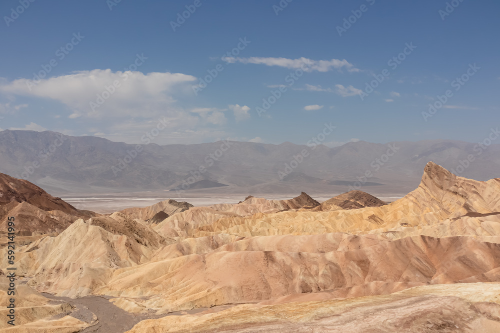 Scenic view of summit peak Manly Beacon seen from Zabriskie Point, Badlands, Furnace creek, Death Valley National Park, California, USA. Erosional landscape of multi hued Amargosa Chaos rock formation