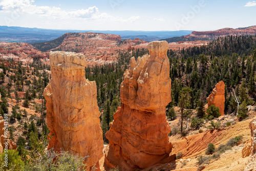 Scenic aerial view of Boat Mesa and massive hoodoo sandstone rock formation tower on Fairyland hiking trail in Bryce Canyon National Park, Utah, USA. Unique nature in barren landscape. Clouds emerging