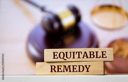 Wooden blocks with words 'Equitable remedy'.