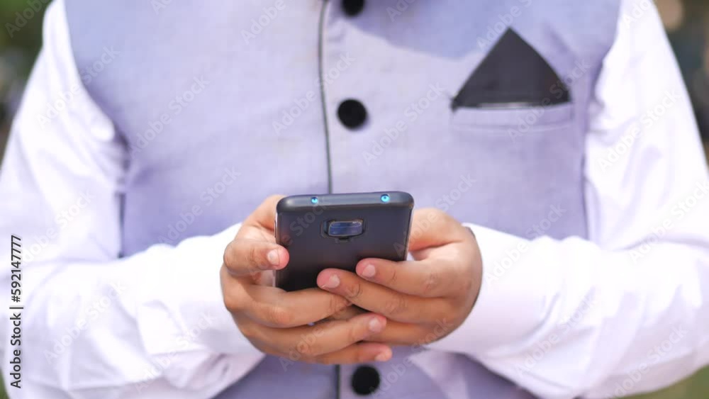 young man in formal dress using smart phone. young man in formal dress using smart phone.
