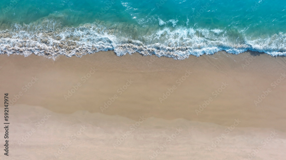 Aerial view with beach in wave of turquoise sea water shot, Top view of beautiful white sand background