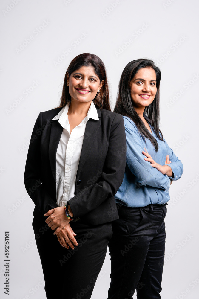 Young confident indian businesswoman standing on white background. Young confident indian businesswoman standing on white background.