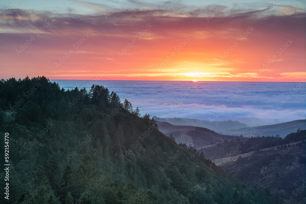 Dramatic Sunset over Santa Cruz Mountains and the Pacific Ocean via Purisima Creek Redwoods, San Mateo County, California, USA. Dramatic Sunset over Santa Cruz Mountains and the Pacific Ocean via Purisima Creek Redwoods, San Mateo County, California, USA.