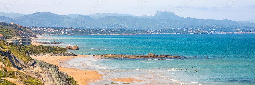 Basque coastline with a view on the mountains of the Pyrenees on a summer day in Biarritz, France