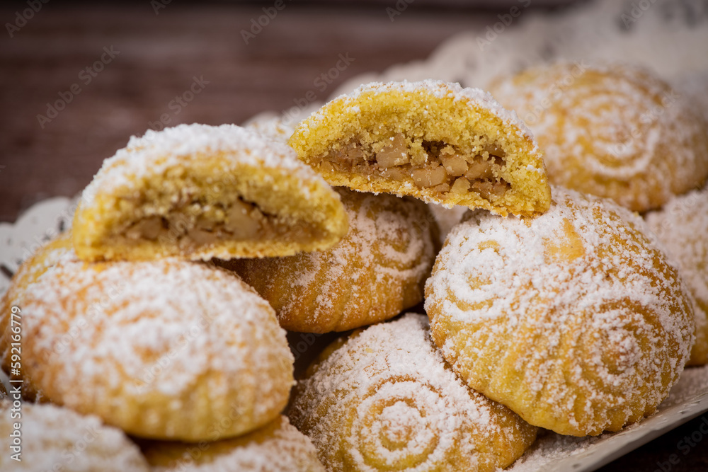 Traditional eid maamoul or mamoul cookies with dates, nuts, and jam, Arabic sweets for Aid al-Fitr and easter, High quality photo