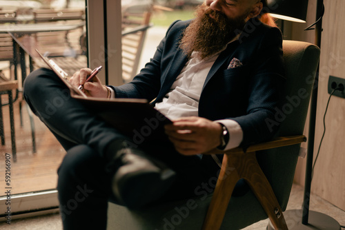 Man writing on his notebook