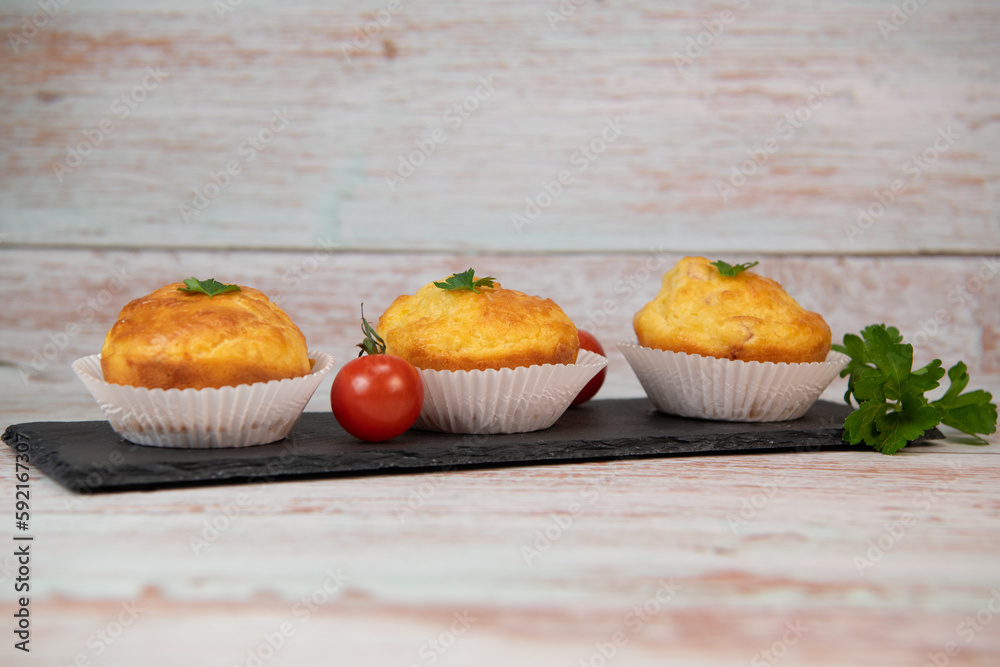 Savory muffin with ham and cheese on blue background, High quality photo Savory muffin with ham and cheese on blue background, High quality photo