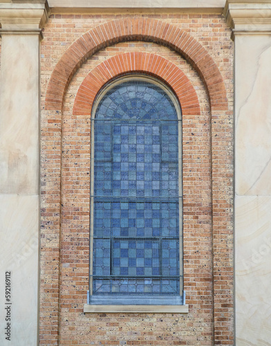 arch window against brick wall in old building