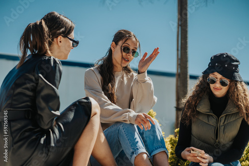 Photos Lovely girl gesticulating with her arm while talking
