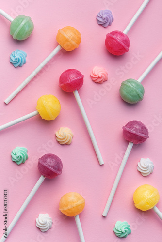 Sweet lollipops and candies on pink background © Olena Rudo