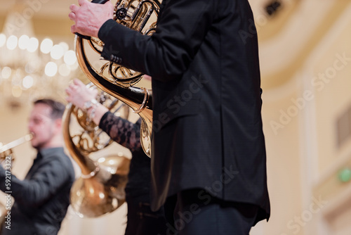 A French horn ensemble during a live performance