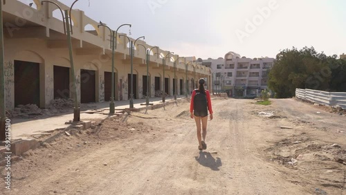 Beautiful Tall girl walking a rural street in Egypt