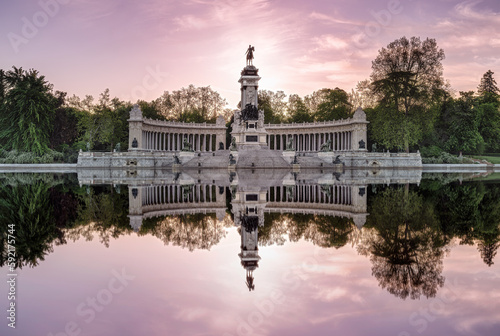 Buen Retiro Park landscape in Madrid, Spain - Sculptural set of King Alfonso XIII at sunrise